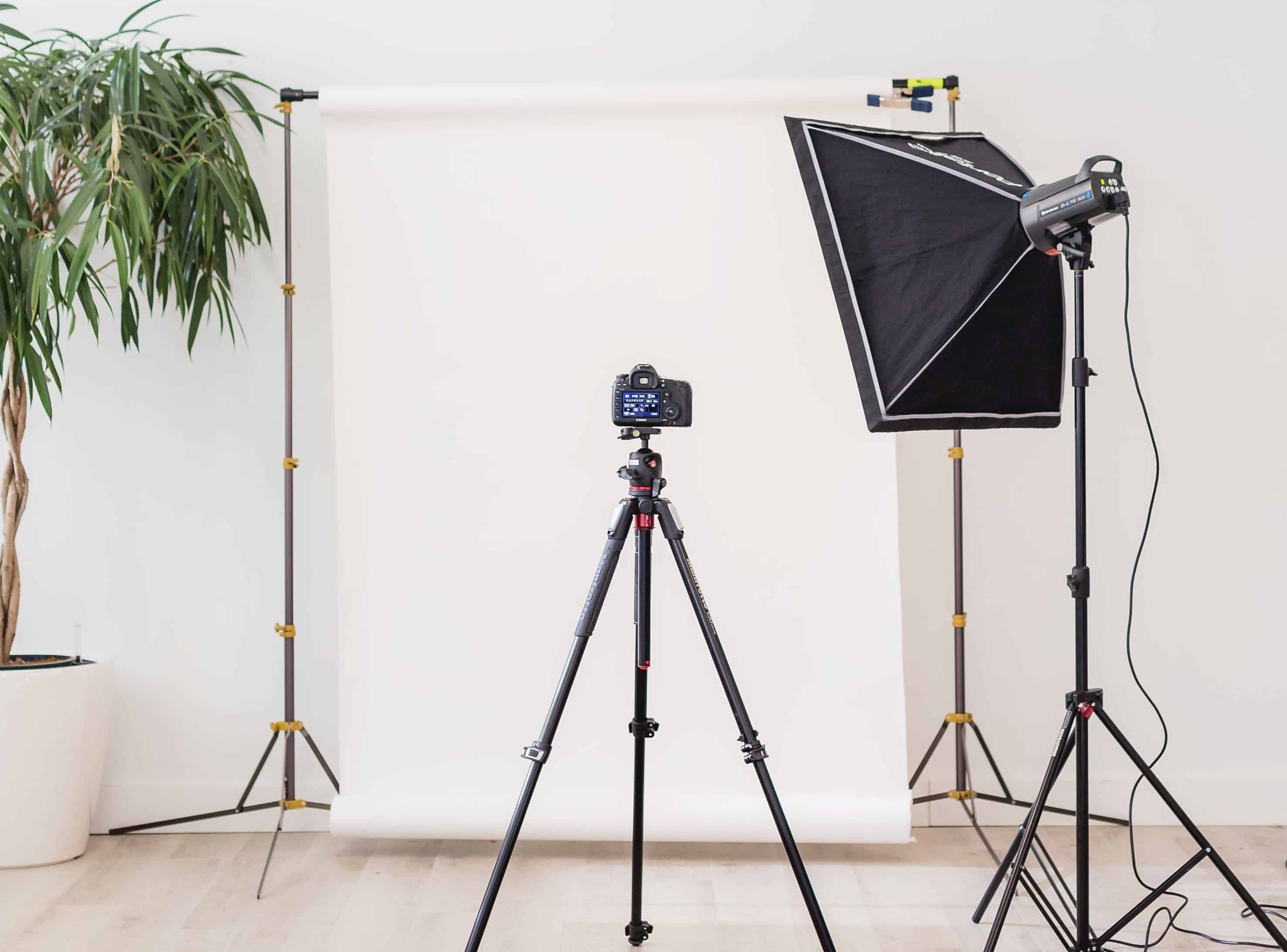 minimal photo studio with camera, light and backdrop