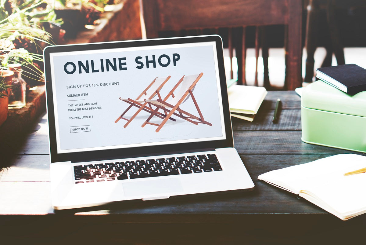 Laptop with an online shop on the screen: how to build a website.
