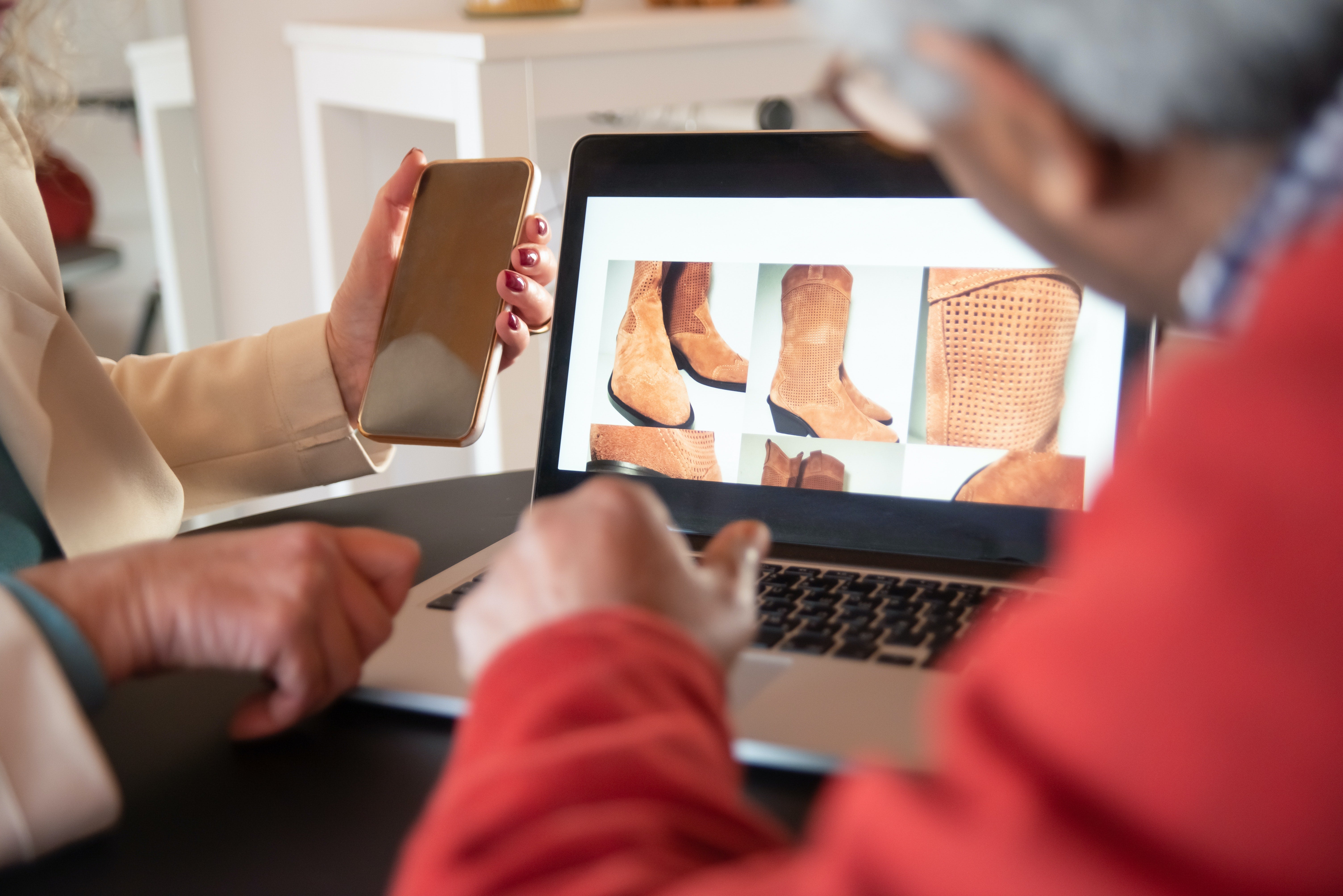 Couple browsing boots on an ecommerce website 