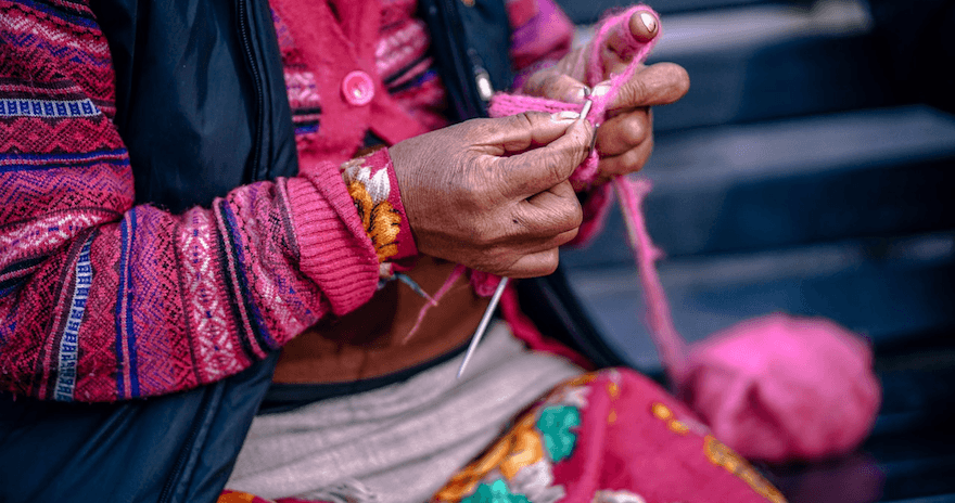 Person knitting a handmade piece of clothing 